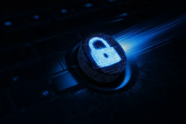 A laptop glowing with a bright login prompt in a minimalistic setup, symbolizing the protected access system at BDTJL.